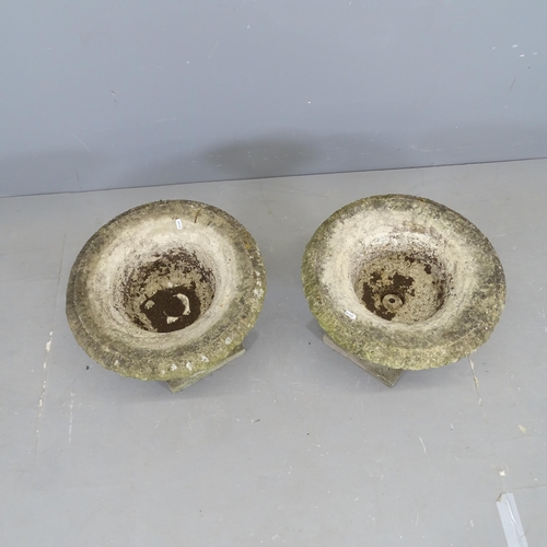 3055 - A pair of weathered concrete garden urns. 47x40cm.