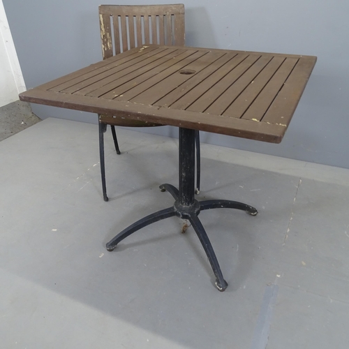 3057 - A square teak tilt-top garden table on cast iron base, 80x75cm, and three matching chairs.