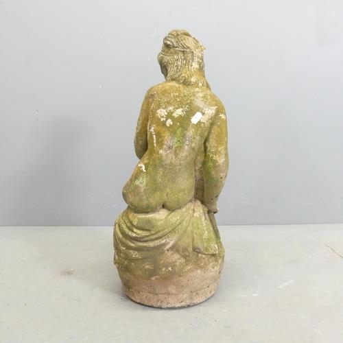 3062 - A weathered stone garden statue, study of a nude seated lady. Height 59cm.