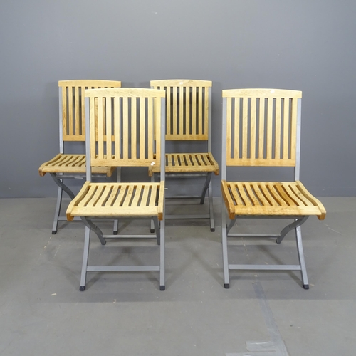 3068 - A set of four modern teak slatted folding garden chairs on metal frames.