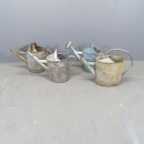 3084 - Four various galvanised metal watering cans.