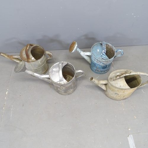 3084 - Four various galvanised metal watering cans.