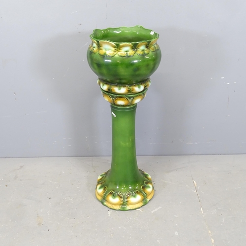 3086 - A Burmantofts style glazed ceramic jardiniere on stand. Height 80cm.