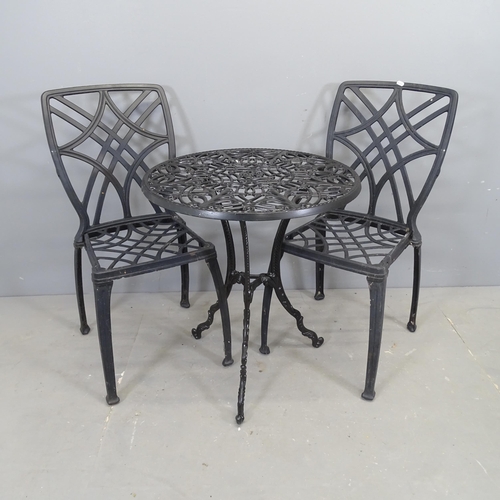 3099 - A painted aluminium circular garden table and two similar chairs. 61x69cm.