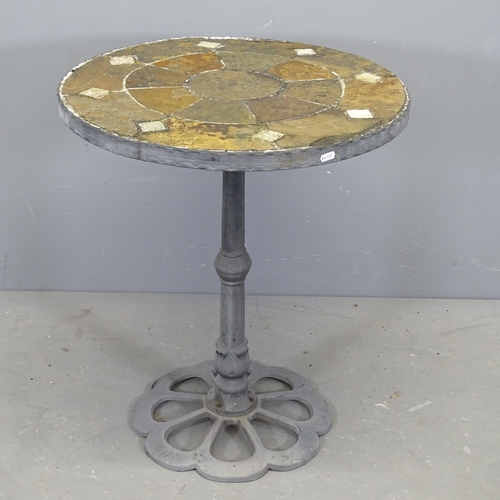 3100 - A circular mosaic topped garden table on painted cast iron base. 61x71cm.