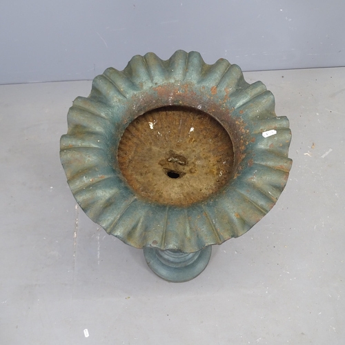 3104 - A French painted cast iron urn on stand, with fluted decoration. 42x77cm.