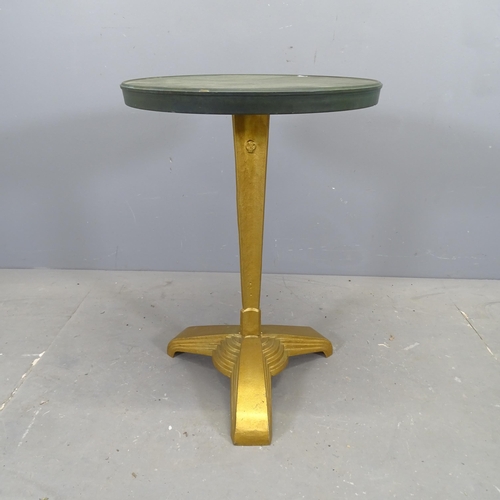 3105 - LOUIS VUITTON - A French Art Deco bistro table with circular Bakelite top on gilt painted cast iron ... 