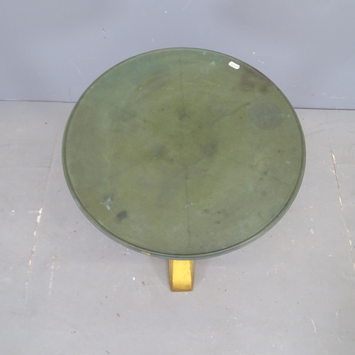 3105 - LOUIS VUITTON - A French Art Deco bistro table with circular Bakelite top on gilt painted cast iron ... 