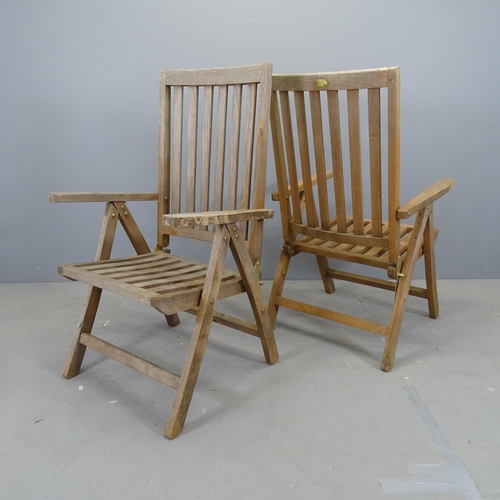 3107 - A set of six weathered teak folding garden chairs.