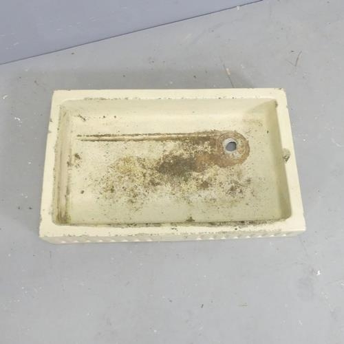 3109 - A glazed rectangular stone butler's sink, with fluted and armorial decoration.