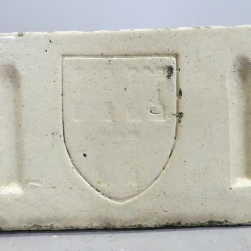 3109 - A glazed rectangular stone butler's sink, with fluted and armorial decoration.