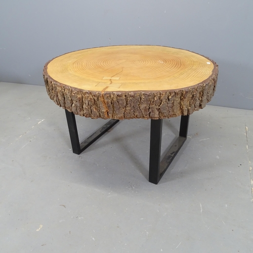 3111 - A live-edge tree slice coffee table on metal sled base. 76x46x72cm.