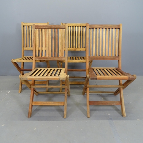 3113 - A set of four teak slatted folding garden chairs.