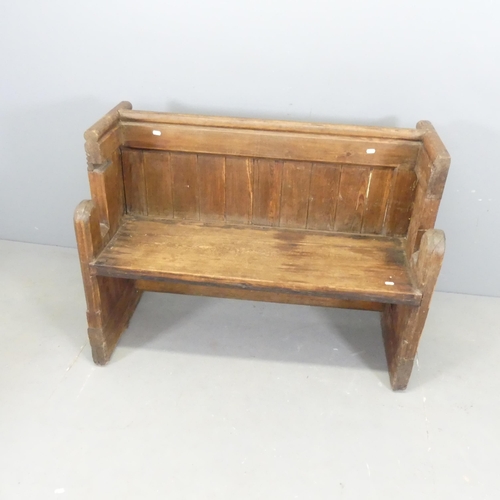 3123 - An oak church pew. 107x80x48cm.