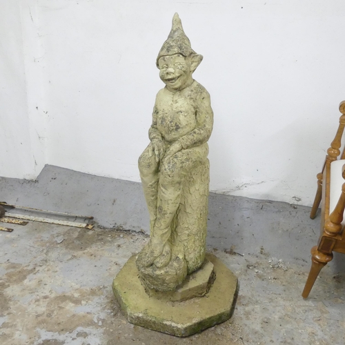 3168 - A large garden statue, study of a pixie on log, on octagonal plinth base. Overall height 112cm.