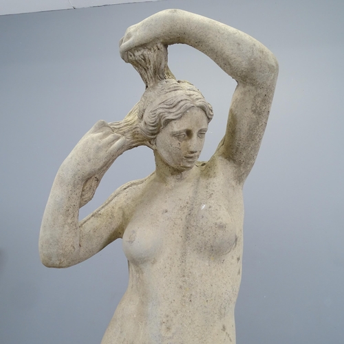 3118 - A concrete garden statue, study of a nude lady. Height 117cm.