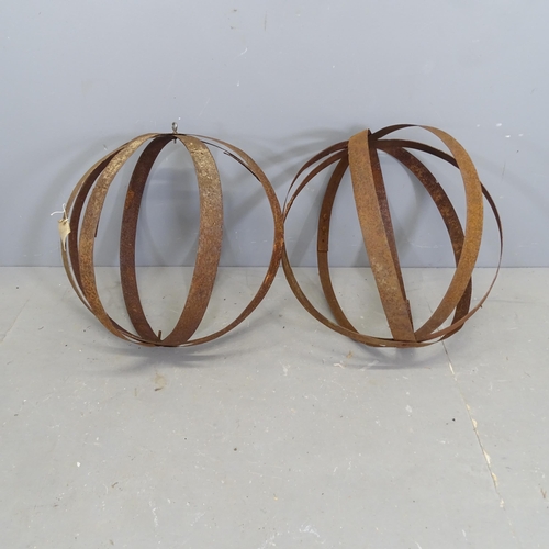 3119 - A pair of weathered steel hanging orb ornaments, Diameter 59cm.