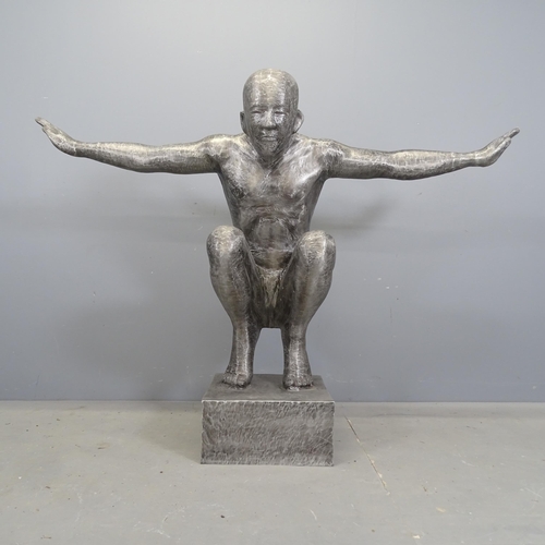 After Marco Olivier - A brushed aluminium sculpture, study of a naked man with outstretched arms. Height 104cm.