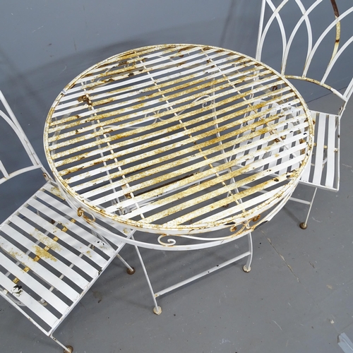 3122 - A painted metal folding garden table, 70x76cm, and a pair of matching chairs.