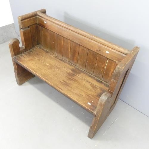 3123 - An oak church pew. 107x80x48cm.