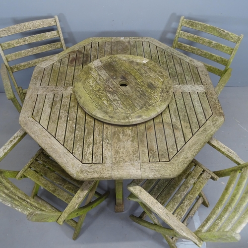 3126 - ALEXANDER ROSE - A weathered teak octagonal drop-leaf garden table and four folding chairs. 120x73cm... 