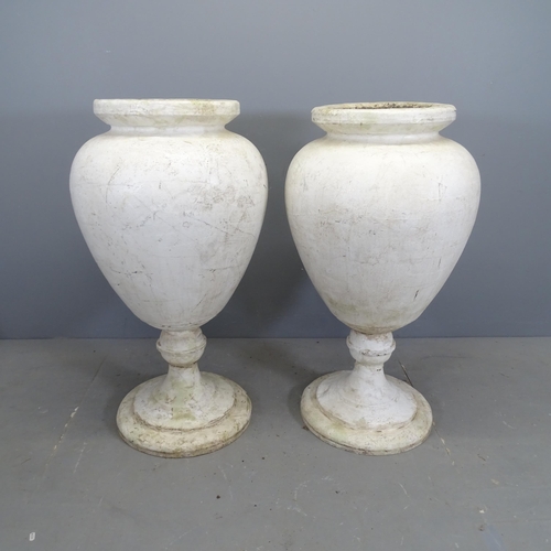 3127 - A pair of Styrofoam urns on stands. 60x105cm.