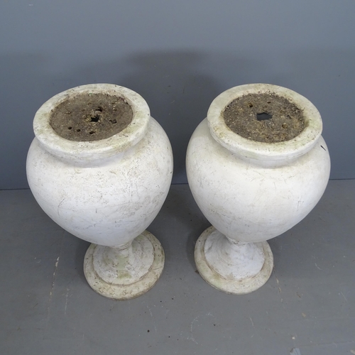 3127 - A pair of Styrofoam urns on stands. 60x105cm.