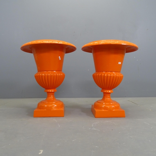 3133 - A pair of French antique orange painted cast iron Campana style urns. 39x48cm.