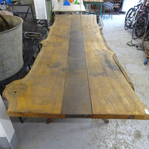 3138 - A large and impressive oak-topped live edge table on steel base. 300x80x110cm.