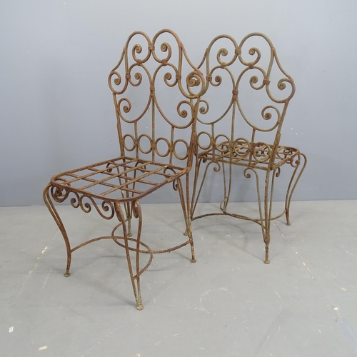 3140 - A set of four wrought iron garden chairs.