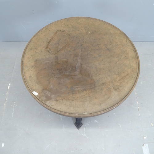 3145 - LOUIS VUITTON - A French Art Deco bistro table with circular Bakelite top on gilt painted cast iron ... 