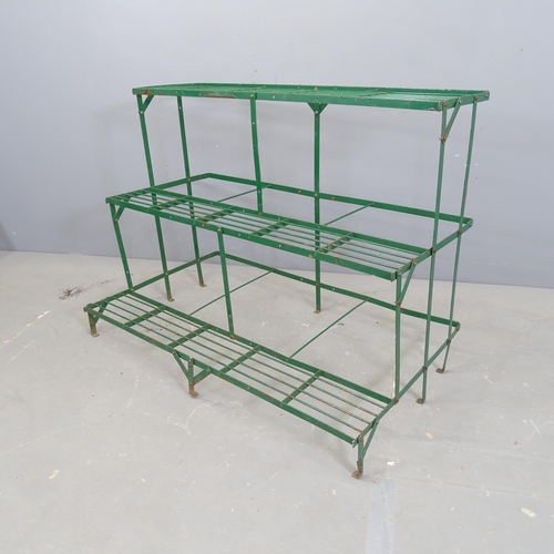 3167 - A modern painted metal three-tier plant stand. 100x75x61cm.