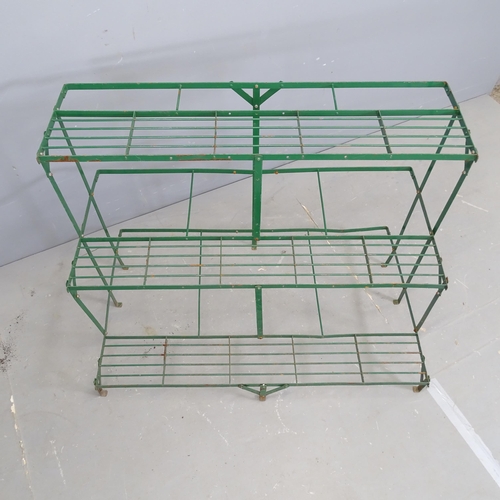 3167 - A modern painted metal three-tier plant stand. 100x75x61cm.