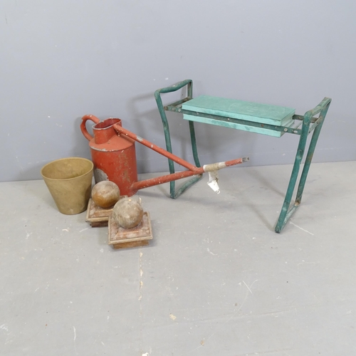 3170 - A group of miscellaneous items to include a watering can, two wooden ball finials, a garden kneeler ... 