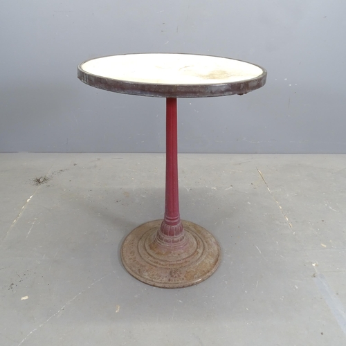 3182 - A French Art Deco circular marble topped bistro table on cast iron base. 55x71cm.