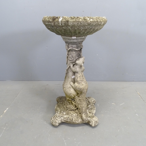 3193 - A weathered concrete two-section bird bath with squirrel decoration. 41x74cm.