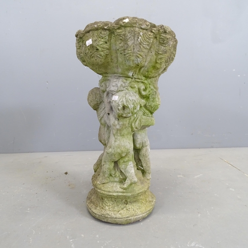 3194 - A weathered concrete bird bath, with cherub design base. 31x55cm.