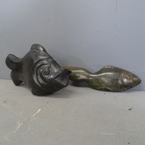 3209 - Two hand carved hardstone fish sculptures. Longest 34cm.