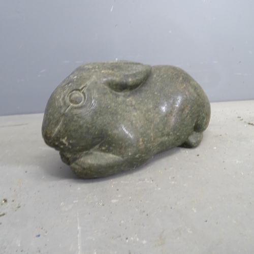 3213 - A hand carved hardstone sculpture, study of a rabbit. Length  36cm.