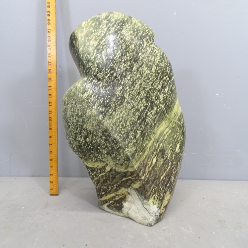 3216 - A hand carved hardstone sculpture, study of a Leopard rock bird. Height 54cm.