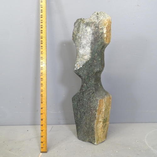 3217 - A handcarved green hardstone sculpture, study of a head in the African style. Height 60cm.