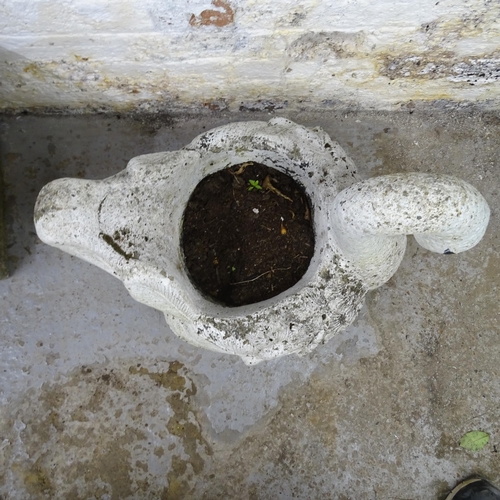 3227 - A painted cast reconstituted stone planter in the form of a swan. 58x50x44cm.