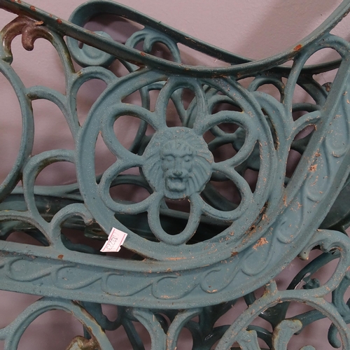 3235 - A pair of painted cast iron bench ends. Height overall 70cm.