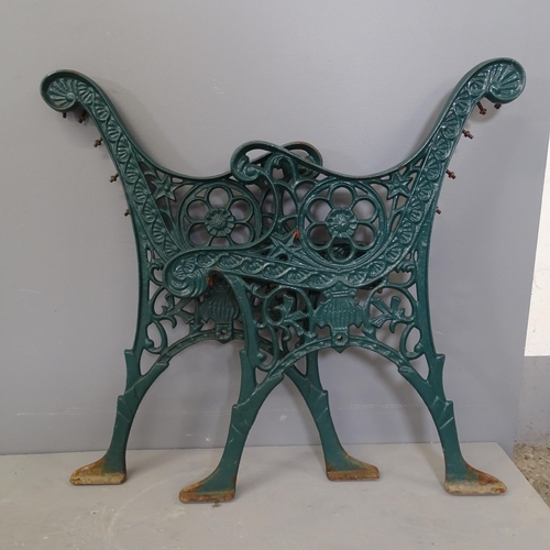 3236 - A pair of painted cast iron bench ends. Height overall 72cm.