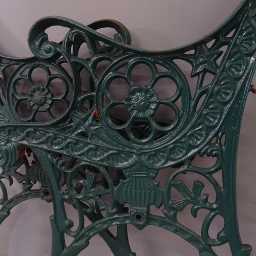 3236 - A pair of painted cast iron bench ends. Height overall 72cm.