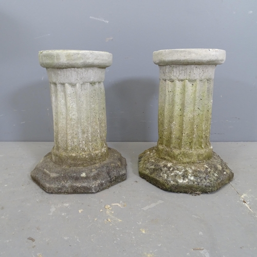 3237 - A pair of weathered concrete Corinthian columns on octagonal bases. Height 35cm.