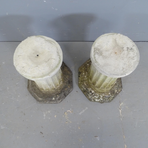 3237 - A pair of weathered concrete Corinthian columns on octagonal bases. Height 35cm.