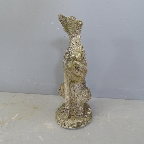 3246 - A weathered concrete garden statue, study of a dog. Height 51cm.