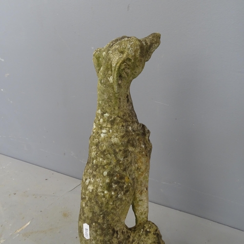 3246 - A weathered concrete garden statue, study of a dog. Height 51cm.