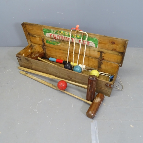 3248 - A vintage Jaques croquet set in pine case. 110x19x27cm.